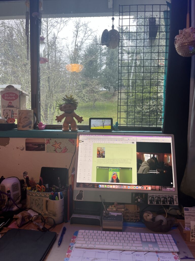 A computer monitor sitting on top of a desk.