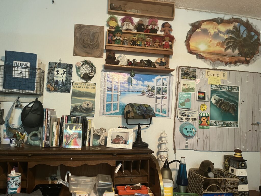 A room with many pictures and other items on the wall.